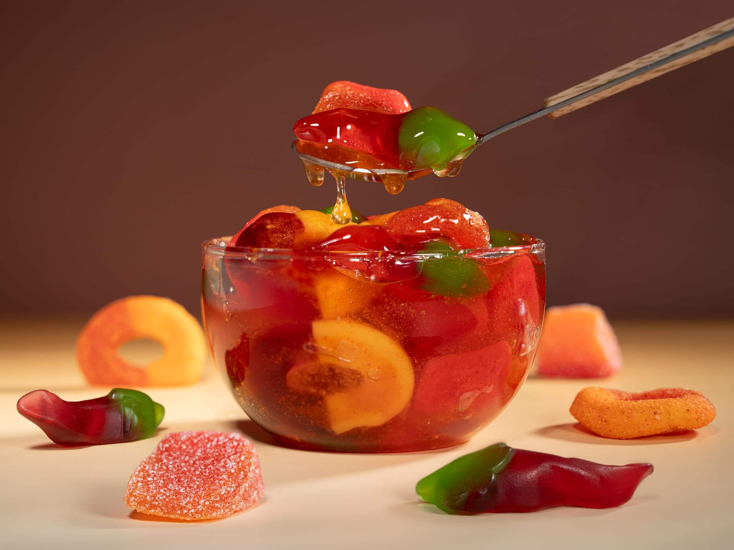 Viral Sour Gooey Gummies in a bowl, showcasing red and green gummy candies with chopsticks.