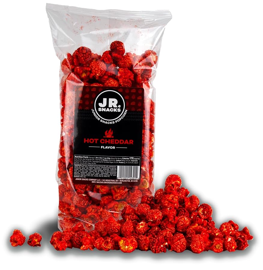 Hot Junior Snacks Co. Hot Cheddar in a bag with spicy, cheesy popcorn spilling out.