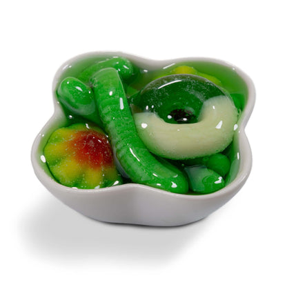 Viral Sour Gooey Gummies in a green bowl featuring assorted gummy candies and a jelly texture.