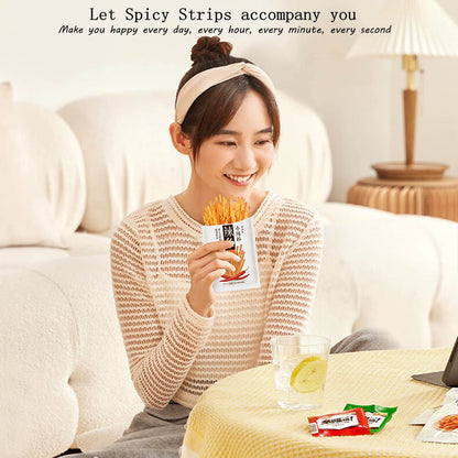 A young woman enjoying a pack of Chinese Spicy Latiao Gluten Strips while sitting at a table.