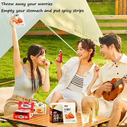 Three friends enjoying Chinese Spicy Latiao Gluten Strips outdoors in a sunny setting.
