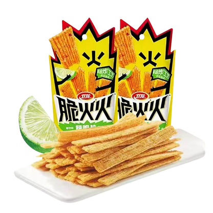 Chinese Spicy Latiao Gluten Strips in vibrant packaging with lime slice on a plate.