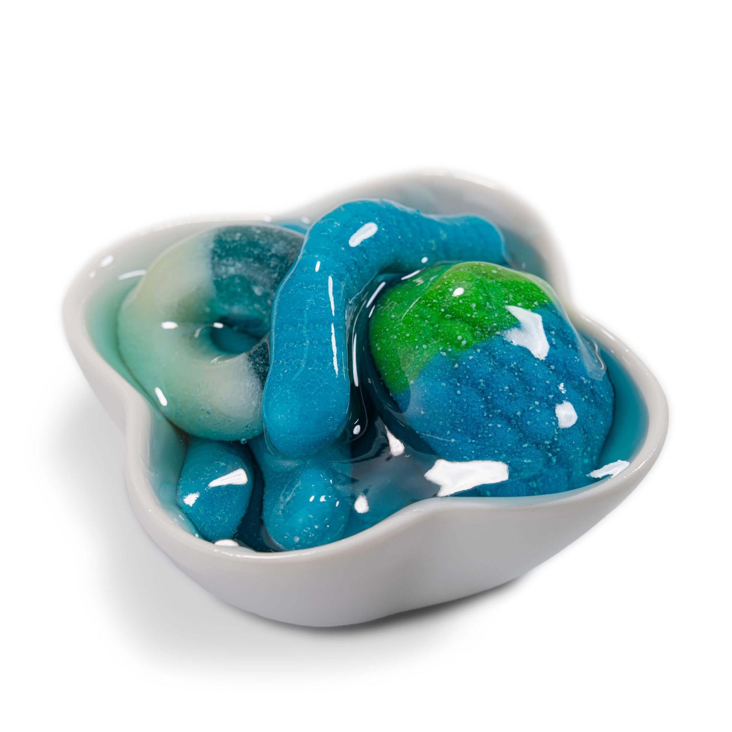 Viral Sour Gooey Gummies in a white dish, showcasing colorful gummy candies with blue and green details.