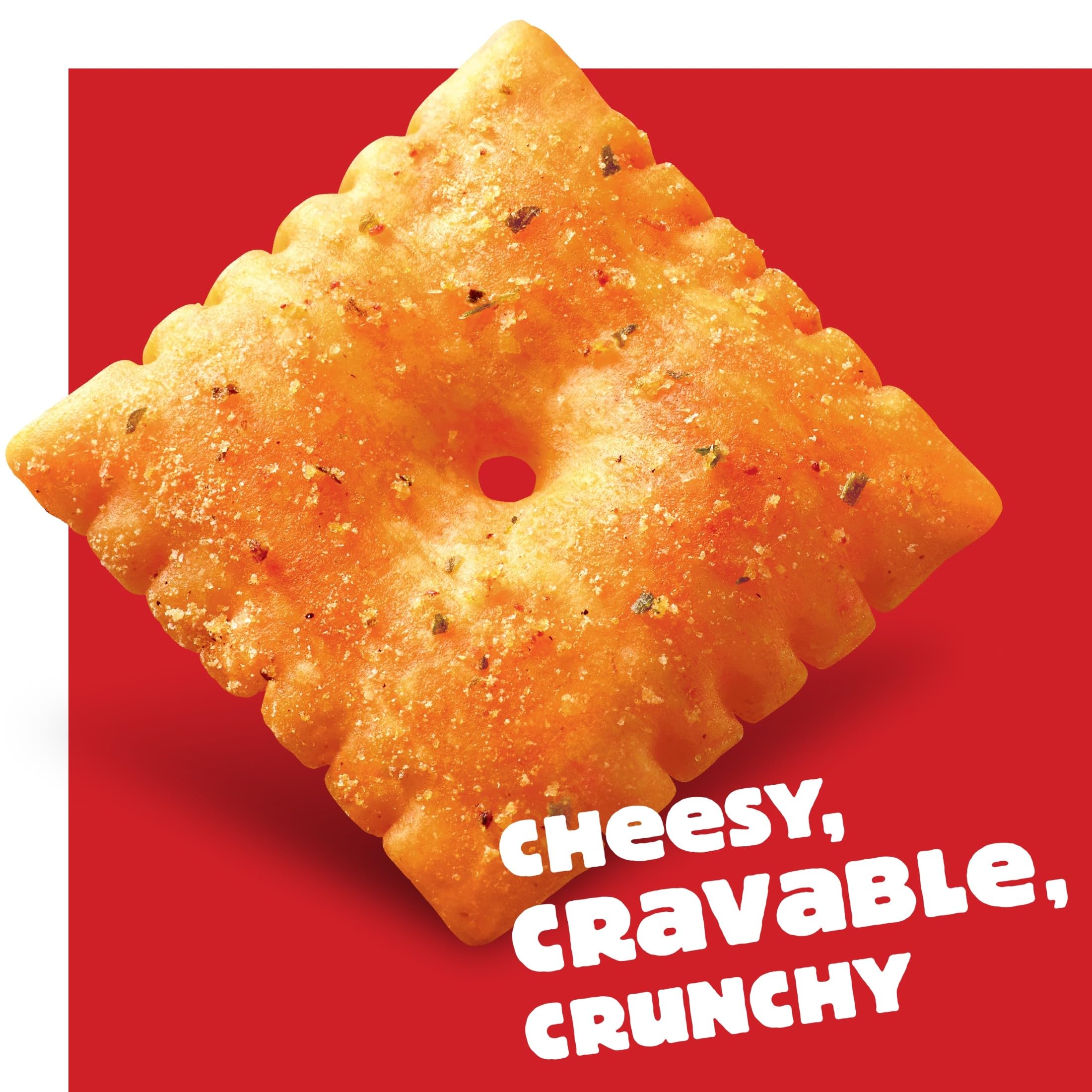 Cheez-It Hot and Spicy Crackers crispy cracker with a cheesy, cravable and crunchy texture on red background.