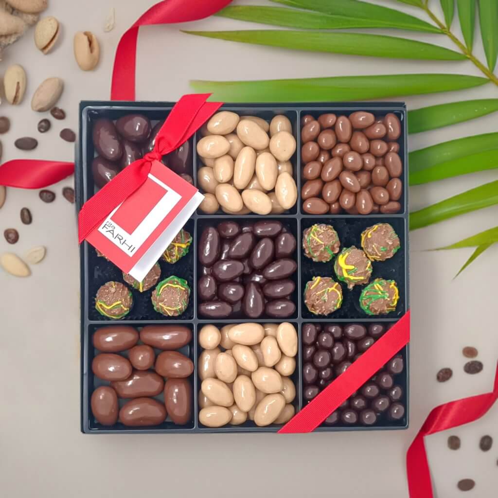 Regal Assortment of Nuts Coffee luxury gift box filled with assorted nuts and chocolate truffles, elegantly arranged.